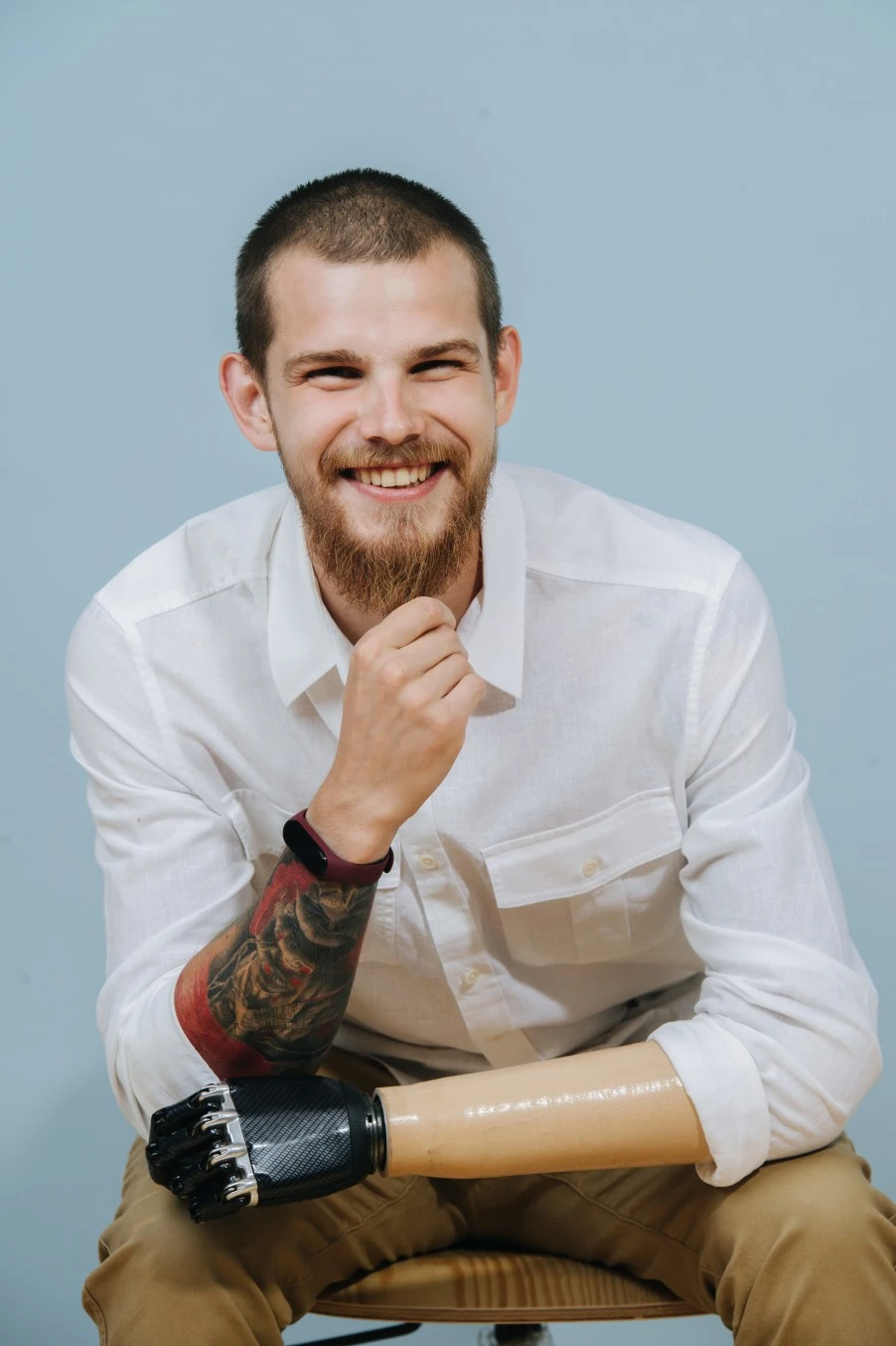 Disabled amputee man smiling at camera